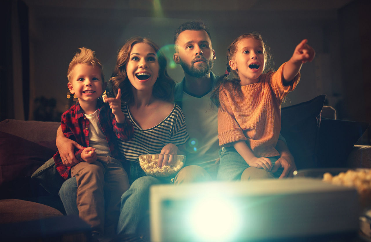 A family watching a movie together | Greystar | Blog 